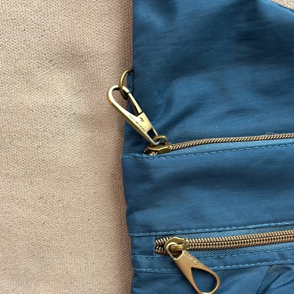 Travelon Blue Crossbody Bag with Adjustable Strap and Soft Fabric - Picture 8 of 9